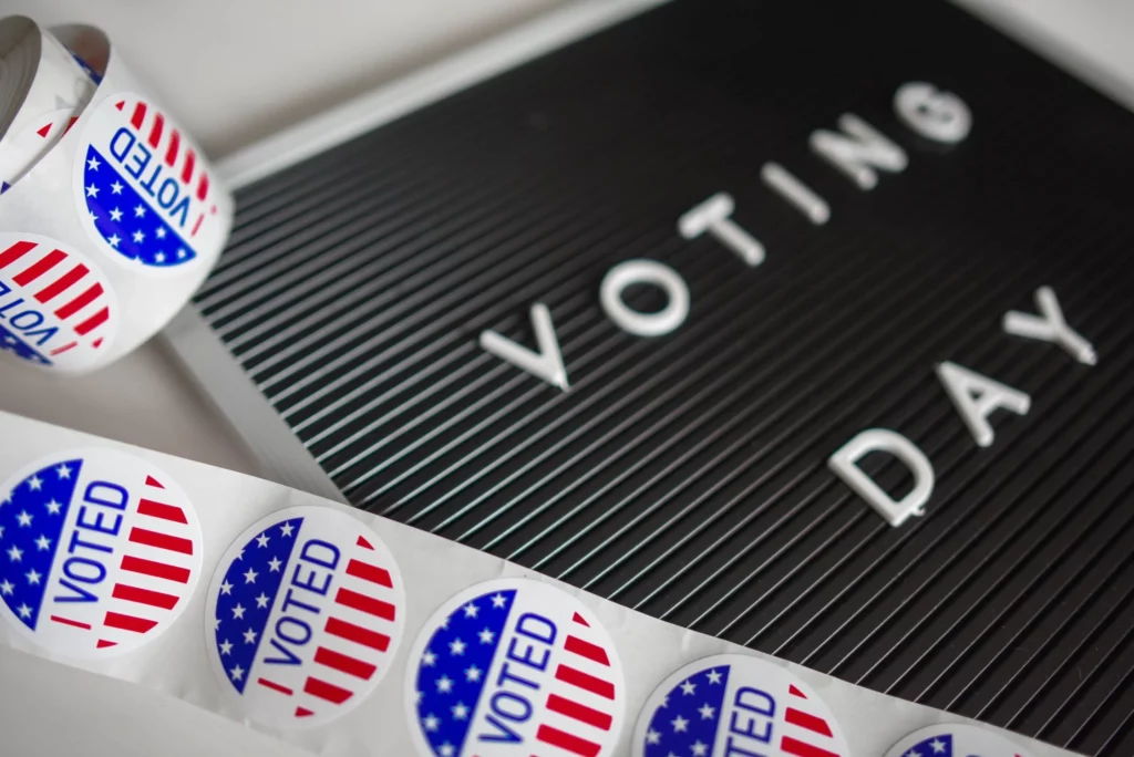 image of board that says voting day and I voted stickers