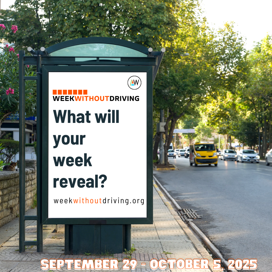 A bus stop sign with a Week Without Driving logo, the website link, and the question what will your week reveal?