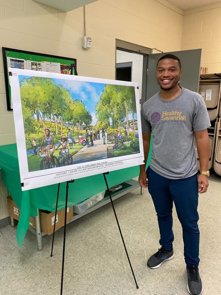 armand turner standing next to tide to town trail concept art