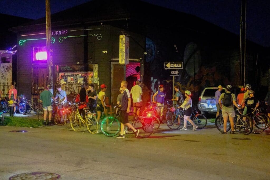 people with bikes at night