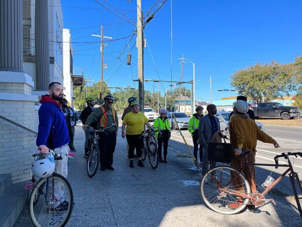 advocates with bikes on a sidewalk