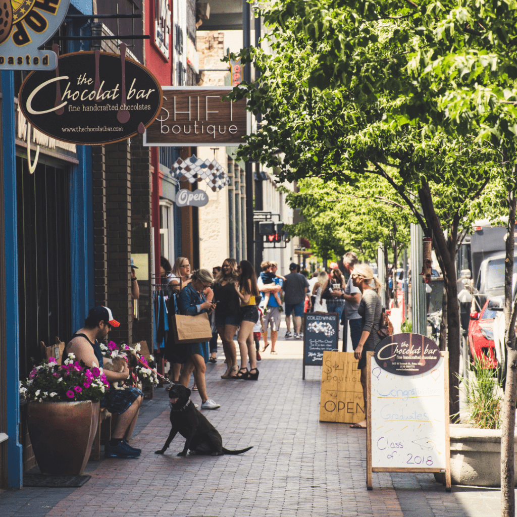 people walking on a sidewalk