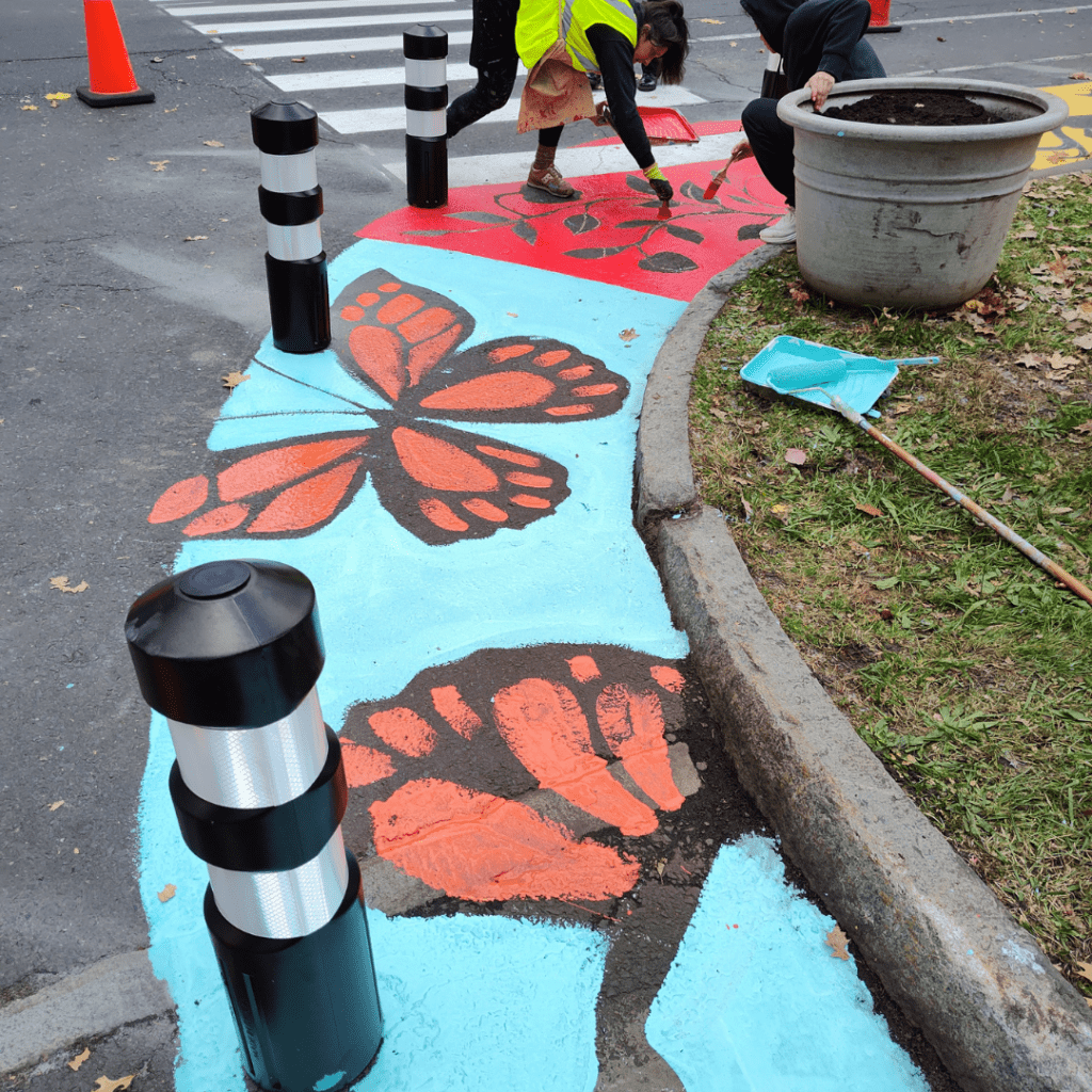 people painting a street