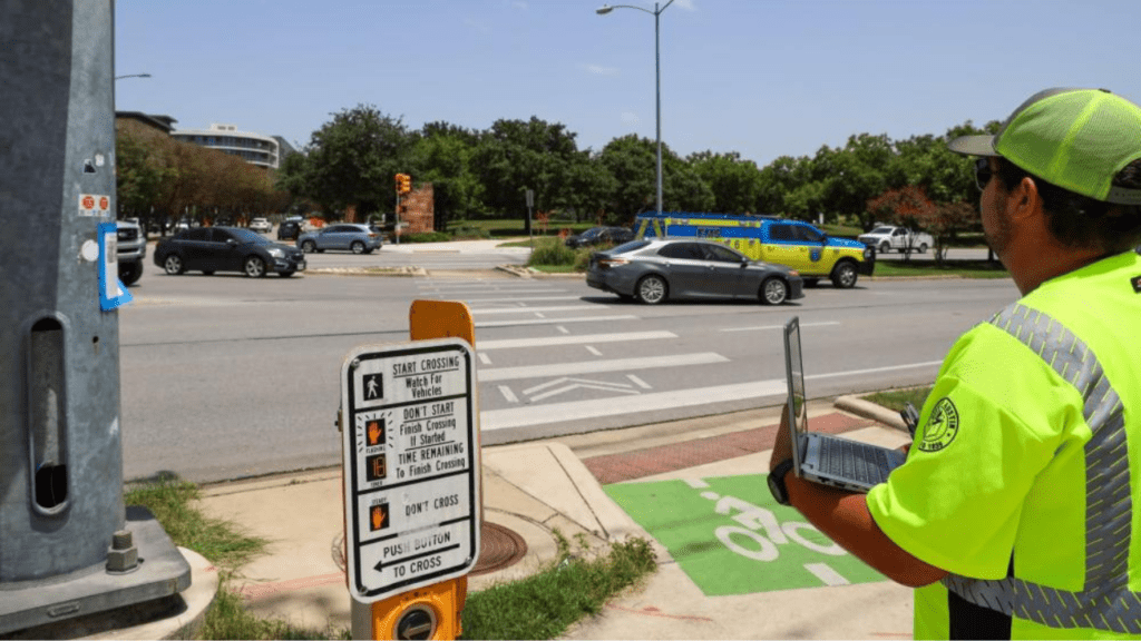 a person in a yellow vest at a crosswalk