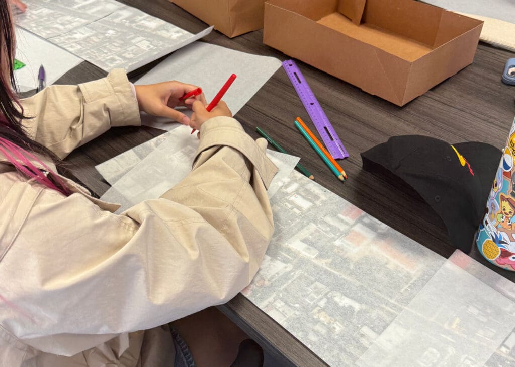 a person drawing maps