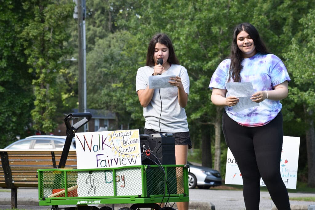 two interns present at walk fairview day