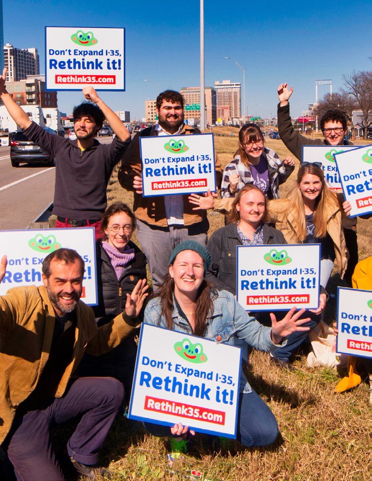 Rethink35 supporters holding signs reading Don't Expand I-35, Rethink it!