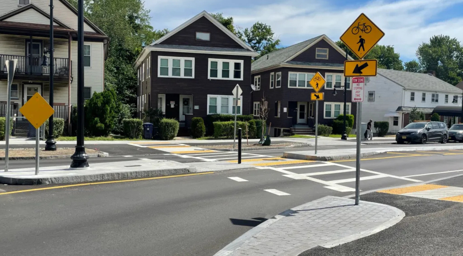 a complete street with a crosswalk and proper signage
